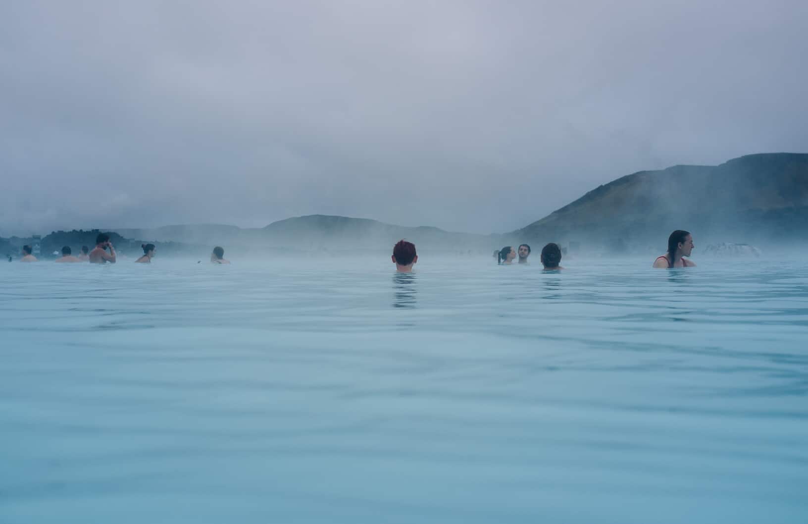 Gamla Laugin Or Secret Lagoon With Bathers on cloudy day