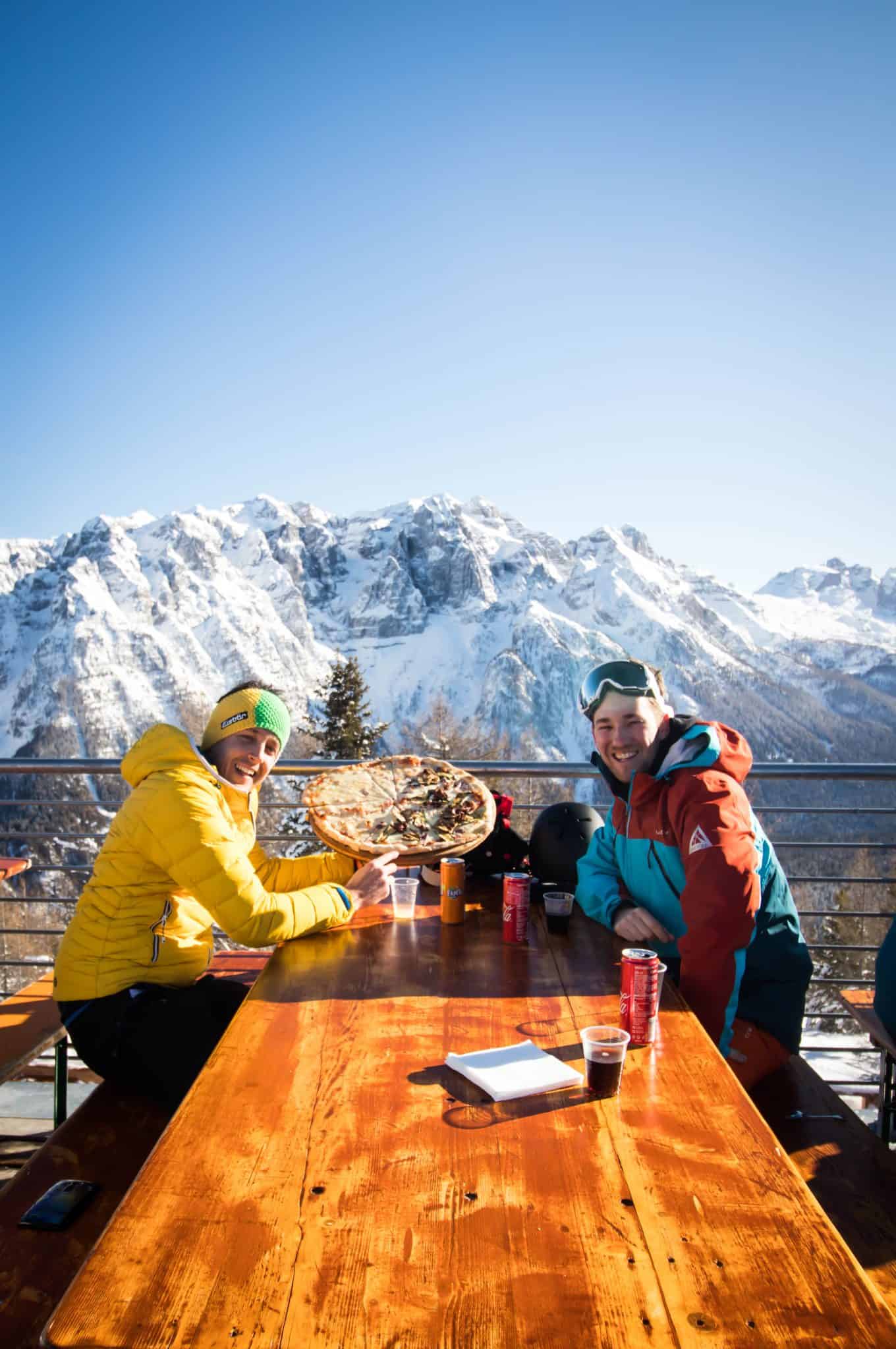 Cameron With A Local Guide Has A Pizza In The Dolomites