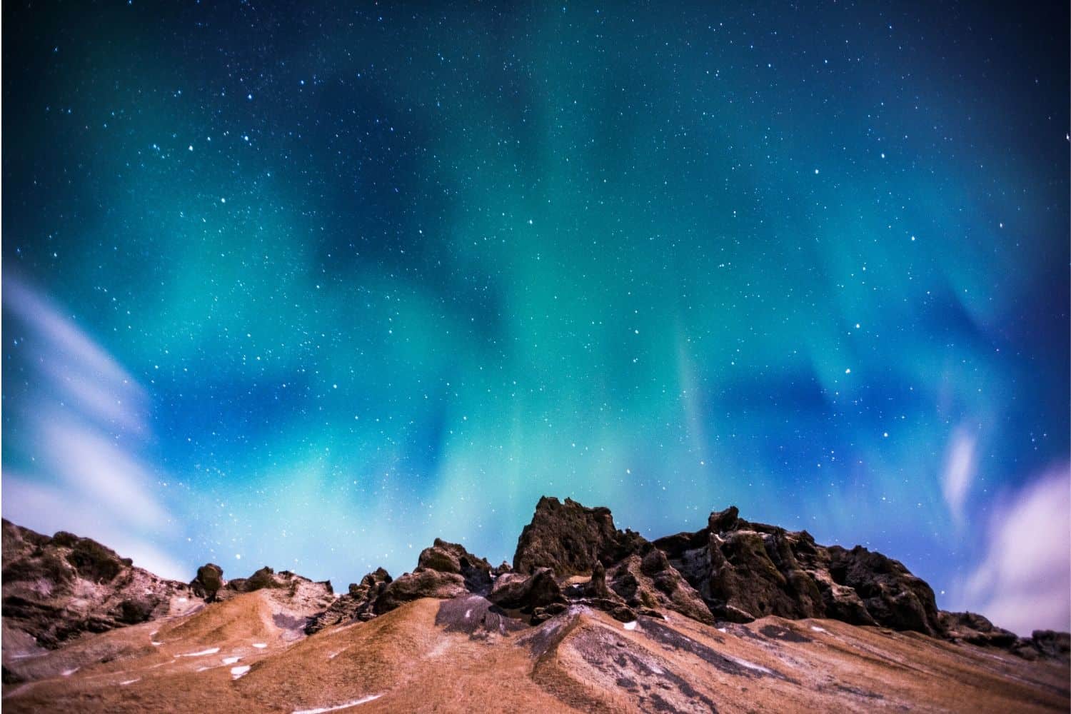 The Northern Lights Over Volcanic Landscape In Iceland