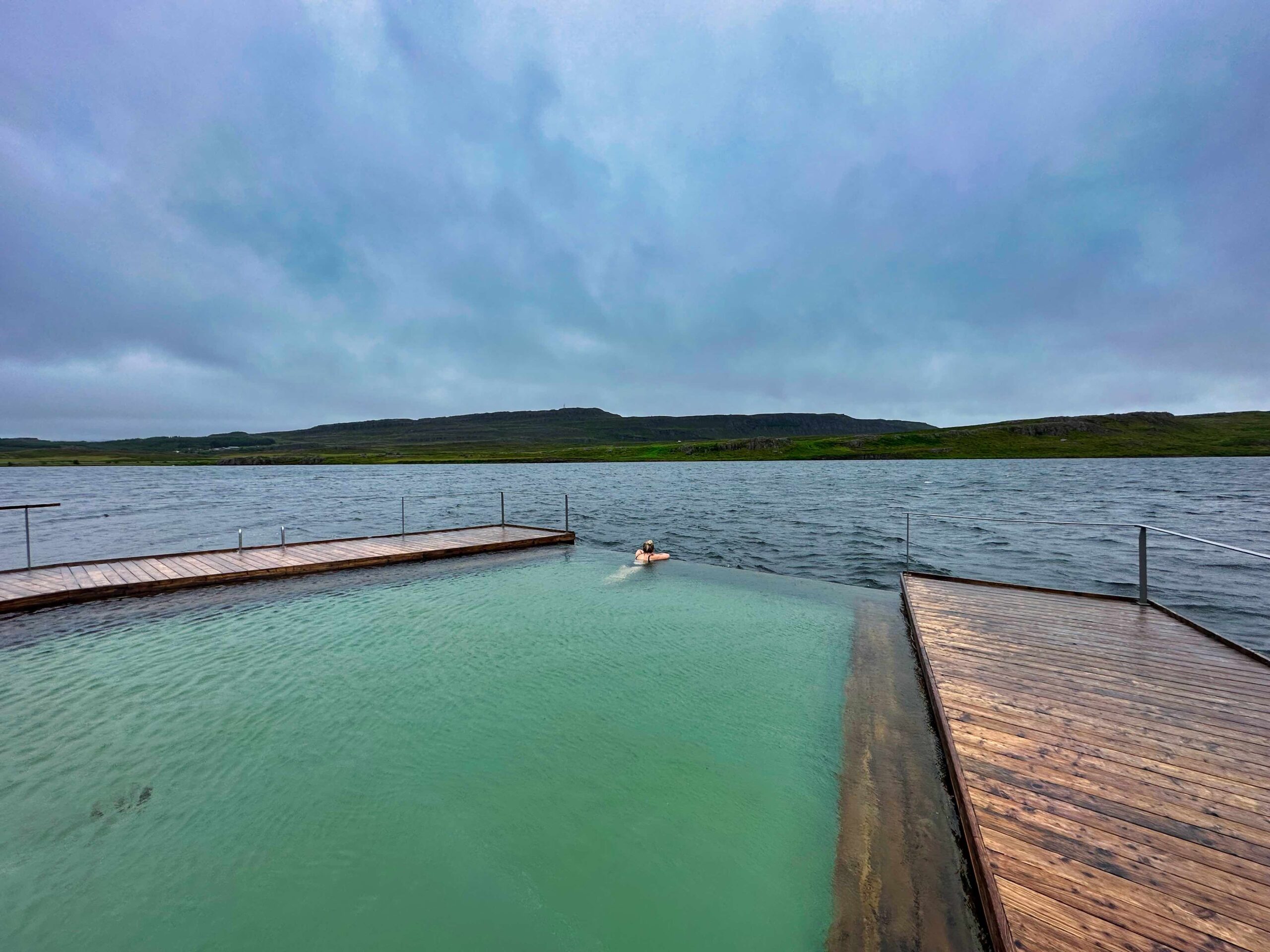 Natasha Relaxes in Vök Hot Spring Alone On An Early Stormy Morning